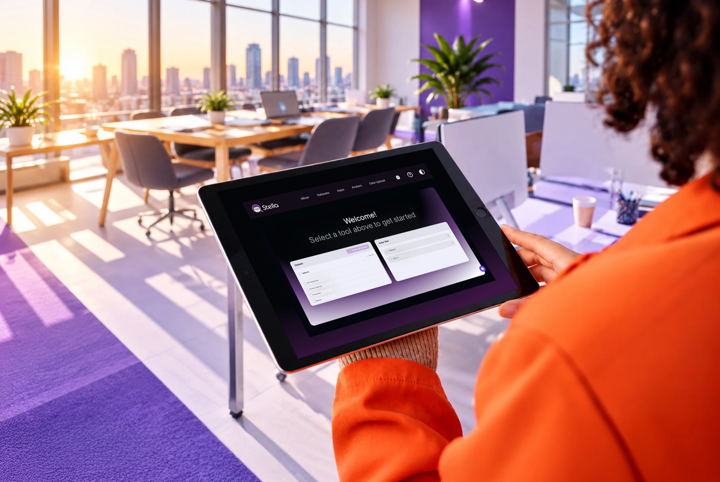 A professional using the Stella Insights interface on a tablet in a bright office.